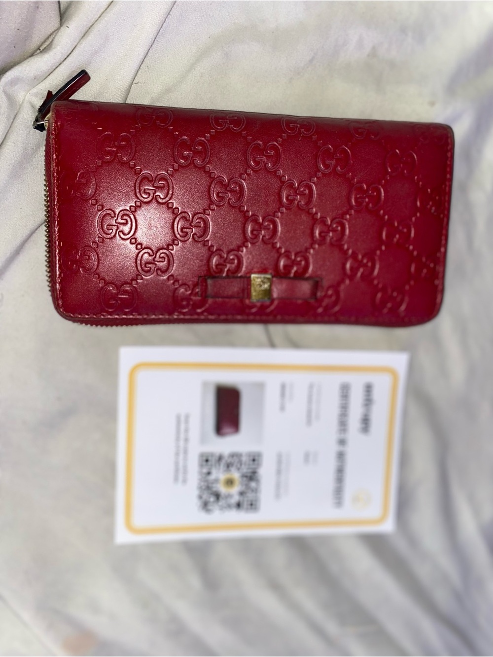 Gucci Red Embossed GG Zip Wallet with Bow Accent